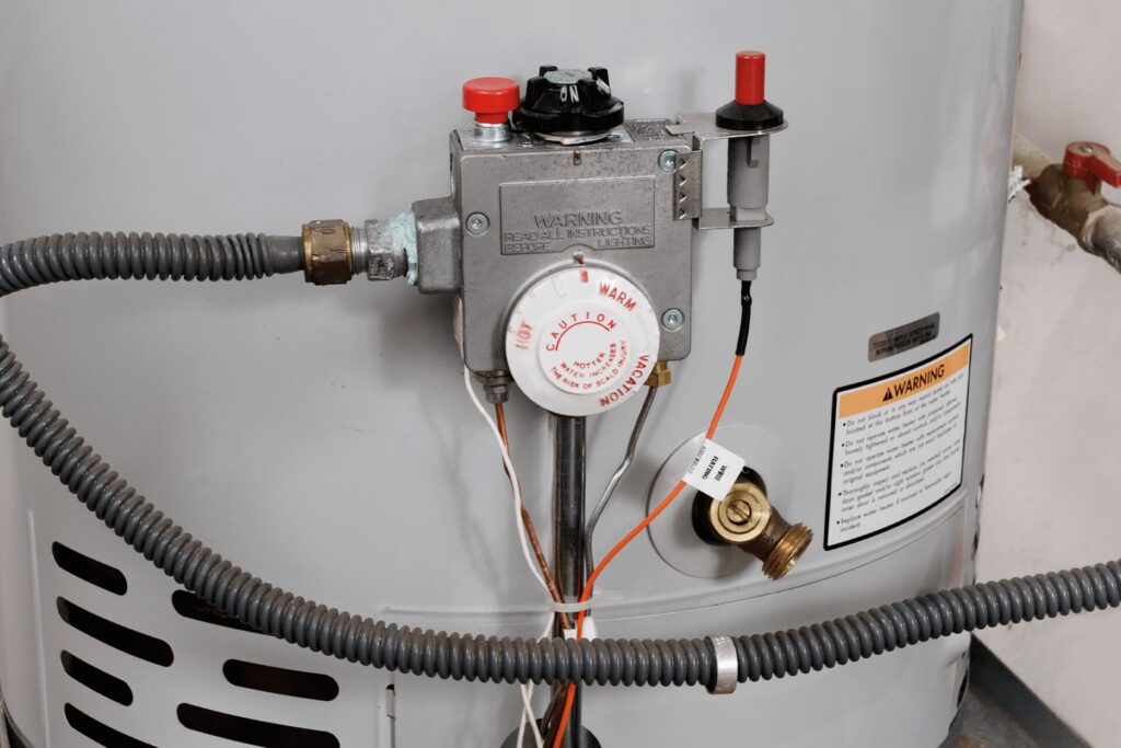 Gas water heater control panel and temperature dial for maintenance in a Shreveport home