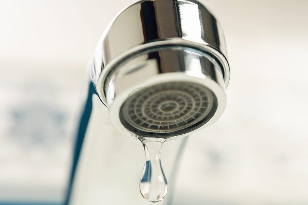 Leaking bathroom faucet close-up symbolizing common plumbing issues in Shreveport homes